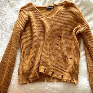 Distressed women’s sweater